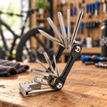 11-in-1 folding bike multi-tool on a workbench